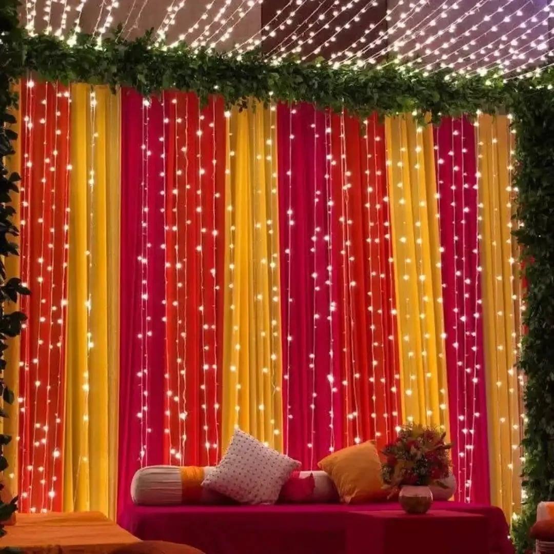 Mayon Mehndi Backdrop with Colorful Drapes and Fairy Lights